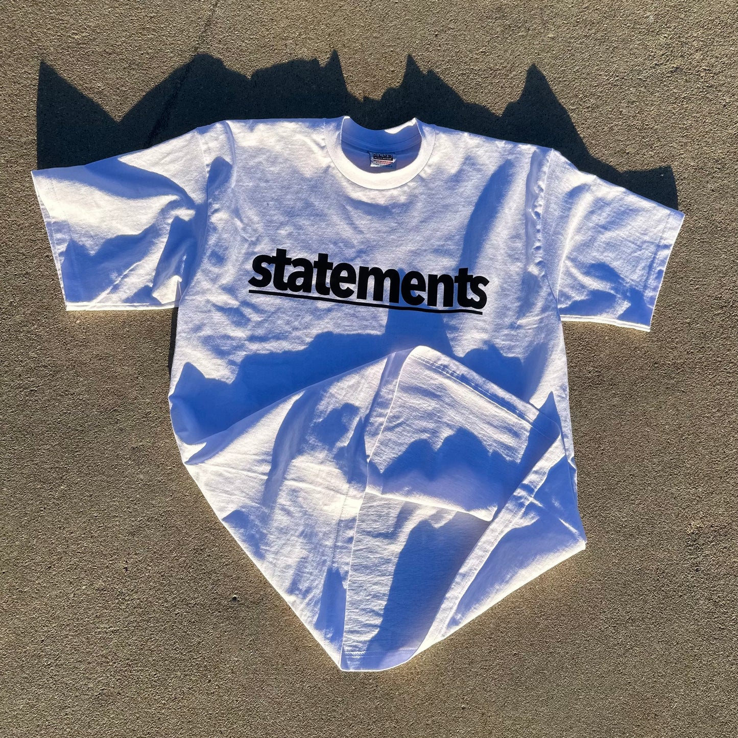 STATEMENTS Essential Tee